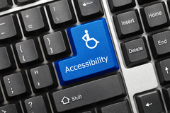 A blue computer button with the accessibility icon on it.